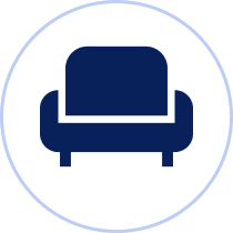 Blue armchair icon on white circle.